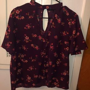Low cut, maroon flowered blouse